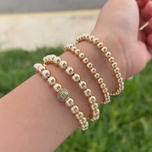 pulsera bolitas doradas